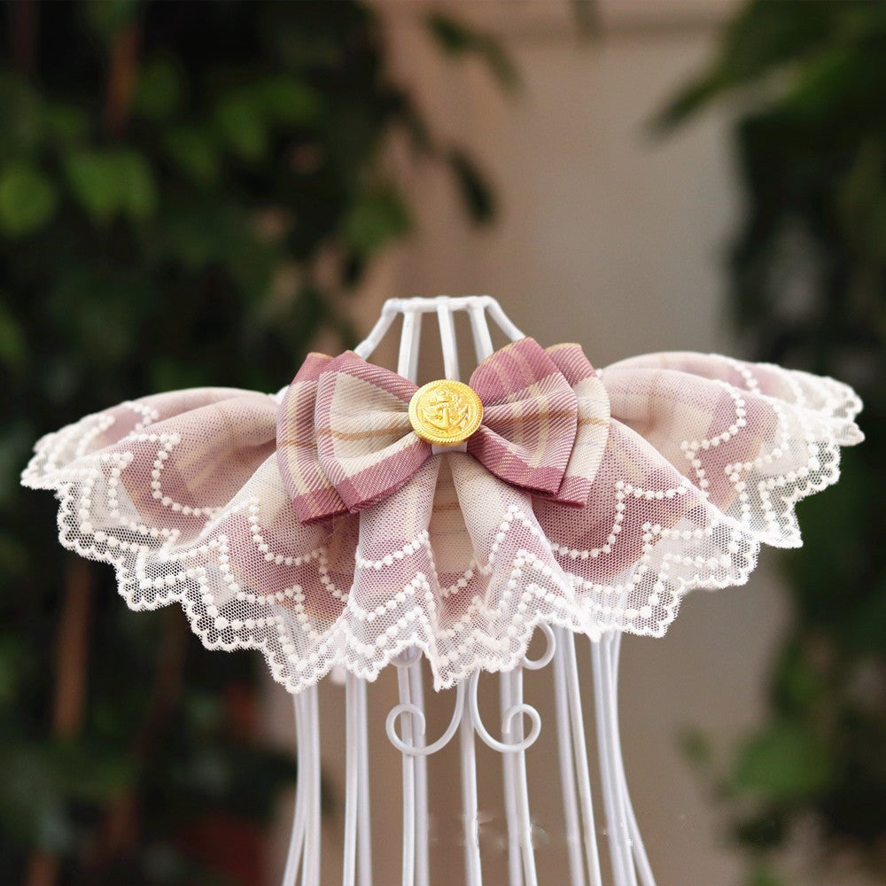 A pink pet bib made of lace