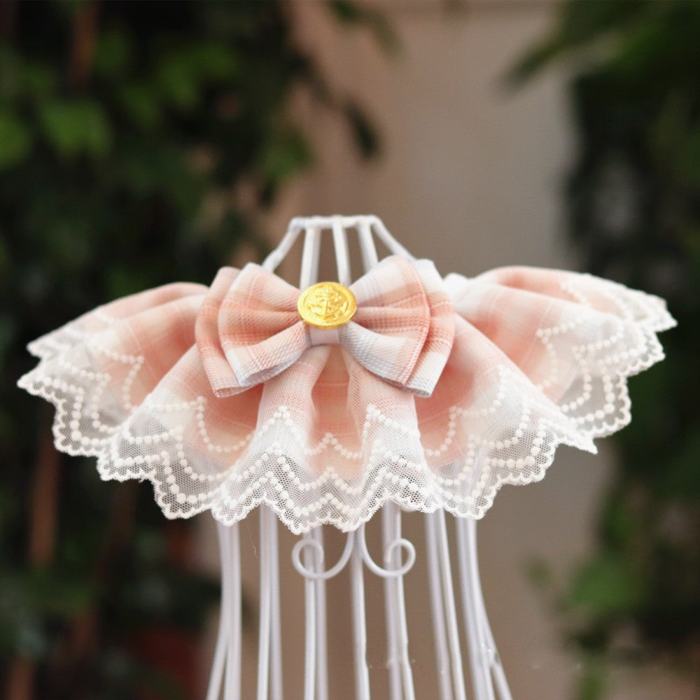An orange pink pet bib made of lace