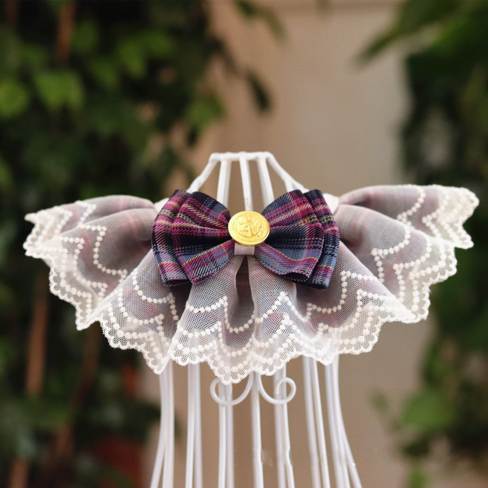 A purple pet bib made of lace