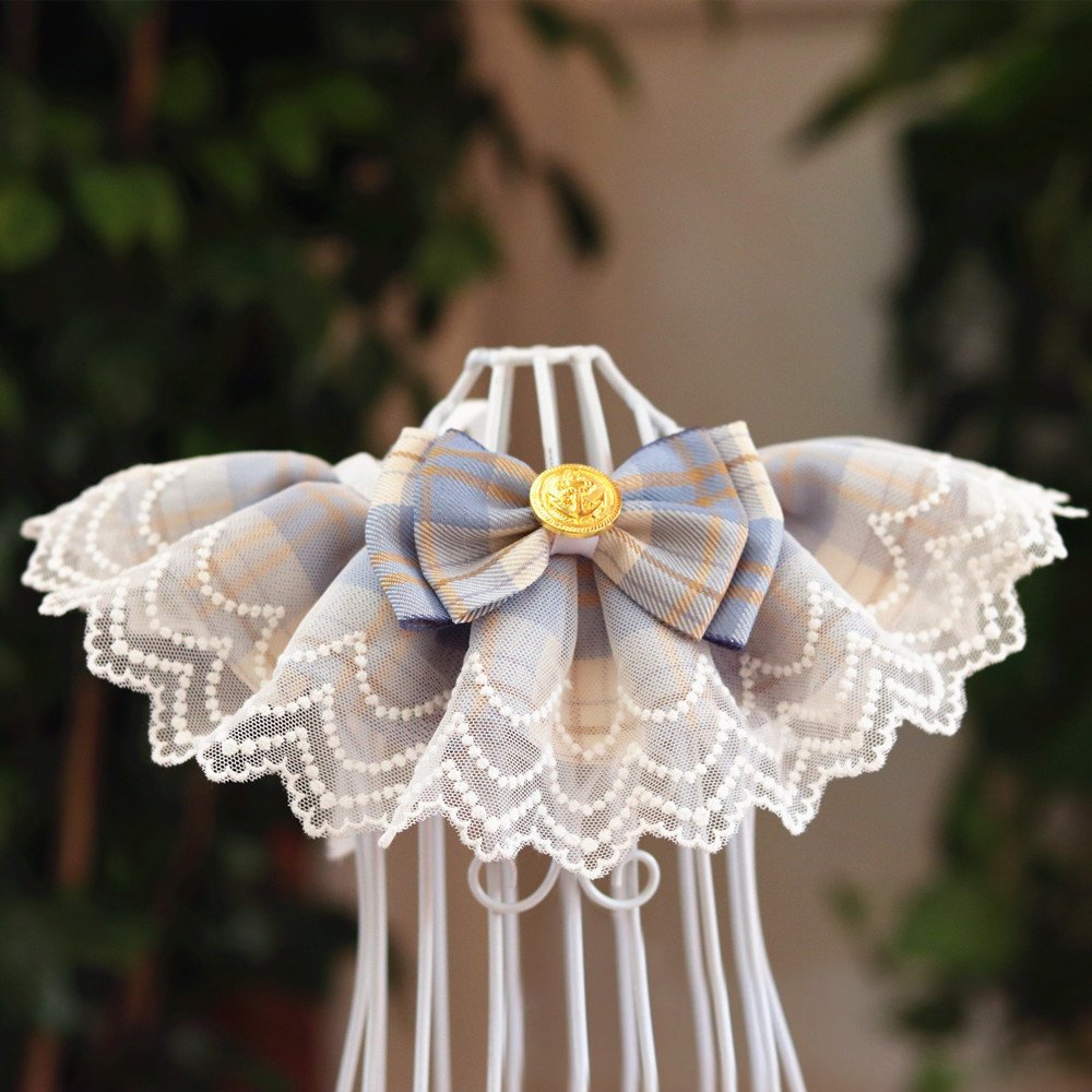 An organge blue pet bib made of lace