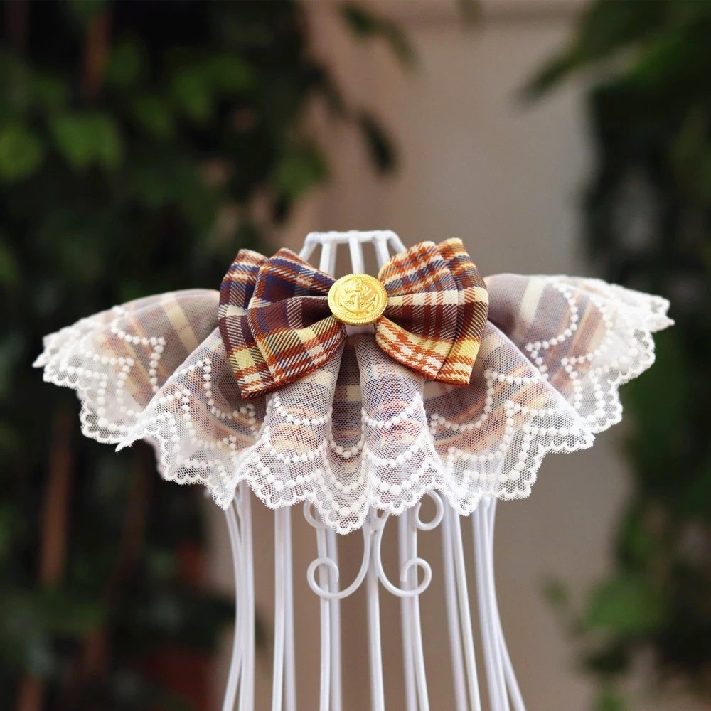 A yellow khaki pet bib made of lace