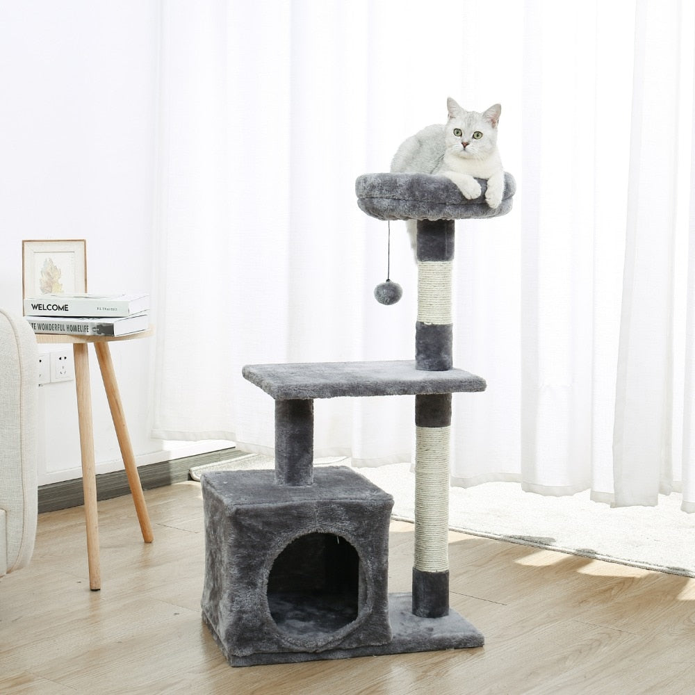 A gray multi-tiered cat tree with a cat sitting on top