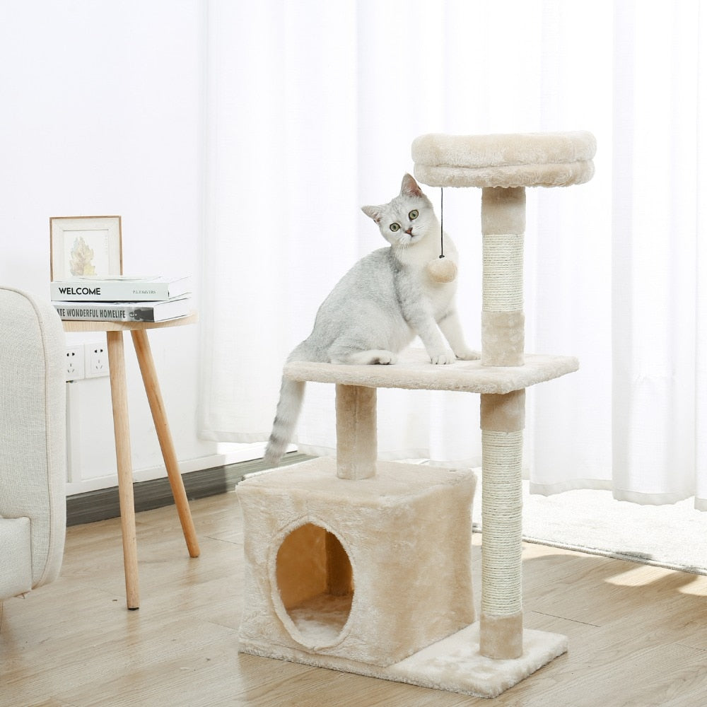 A nude coloured multi layer cat tree with a cat sitting on it