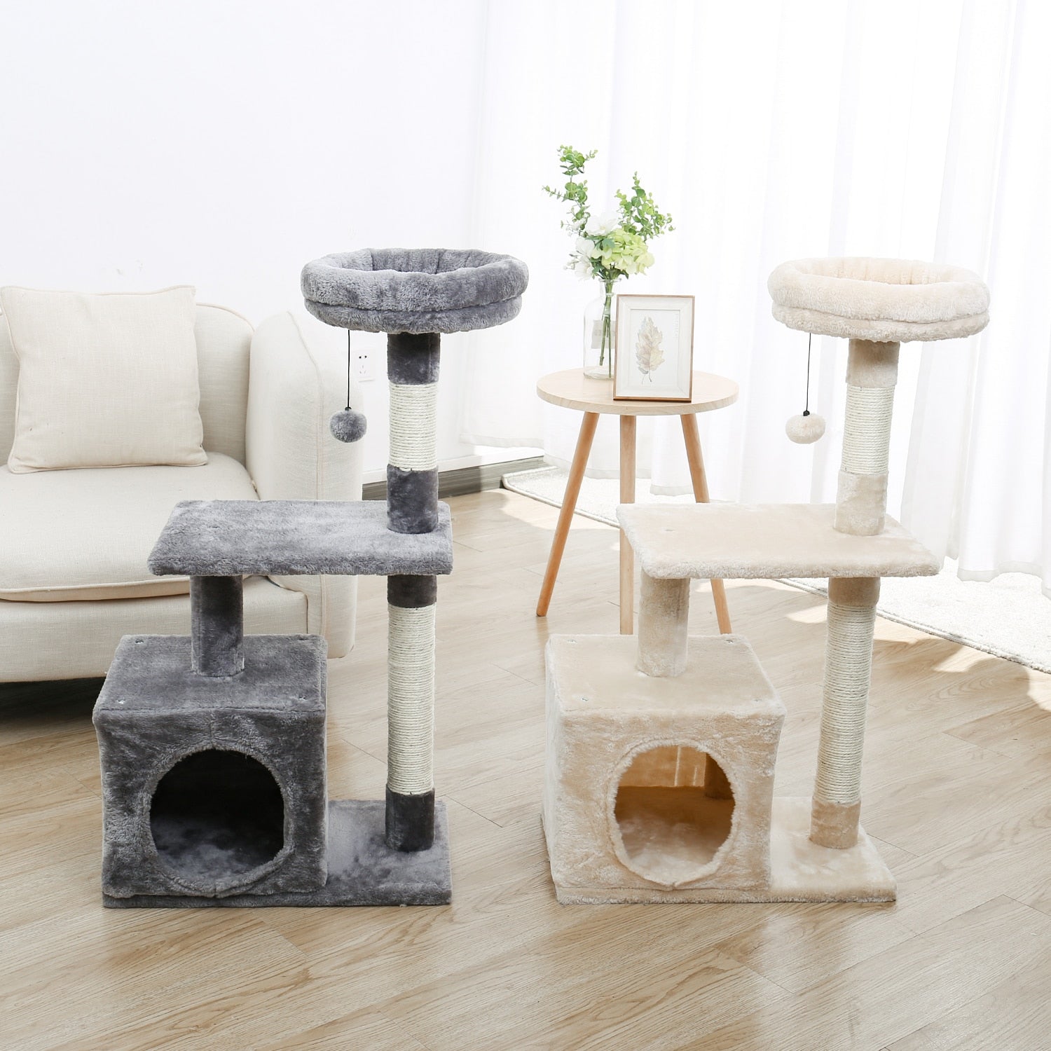 A gray and a nude colour multi-layer cat tree side by side in a living room